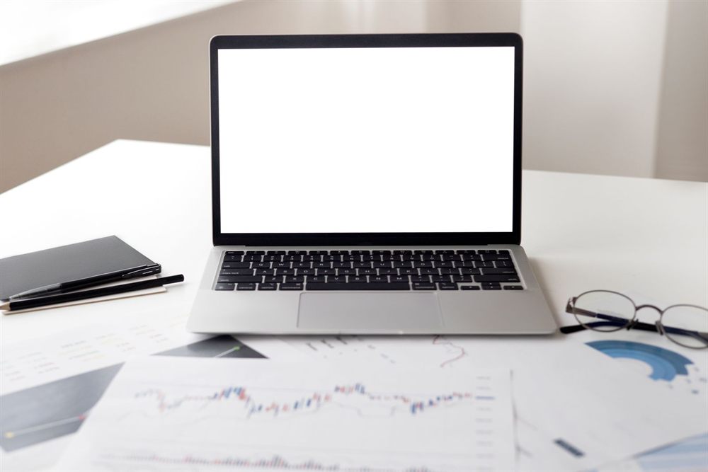 Open laptop with a blank screen on a tidy desk